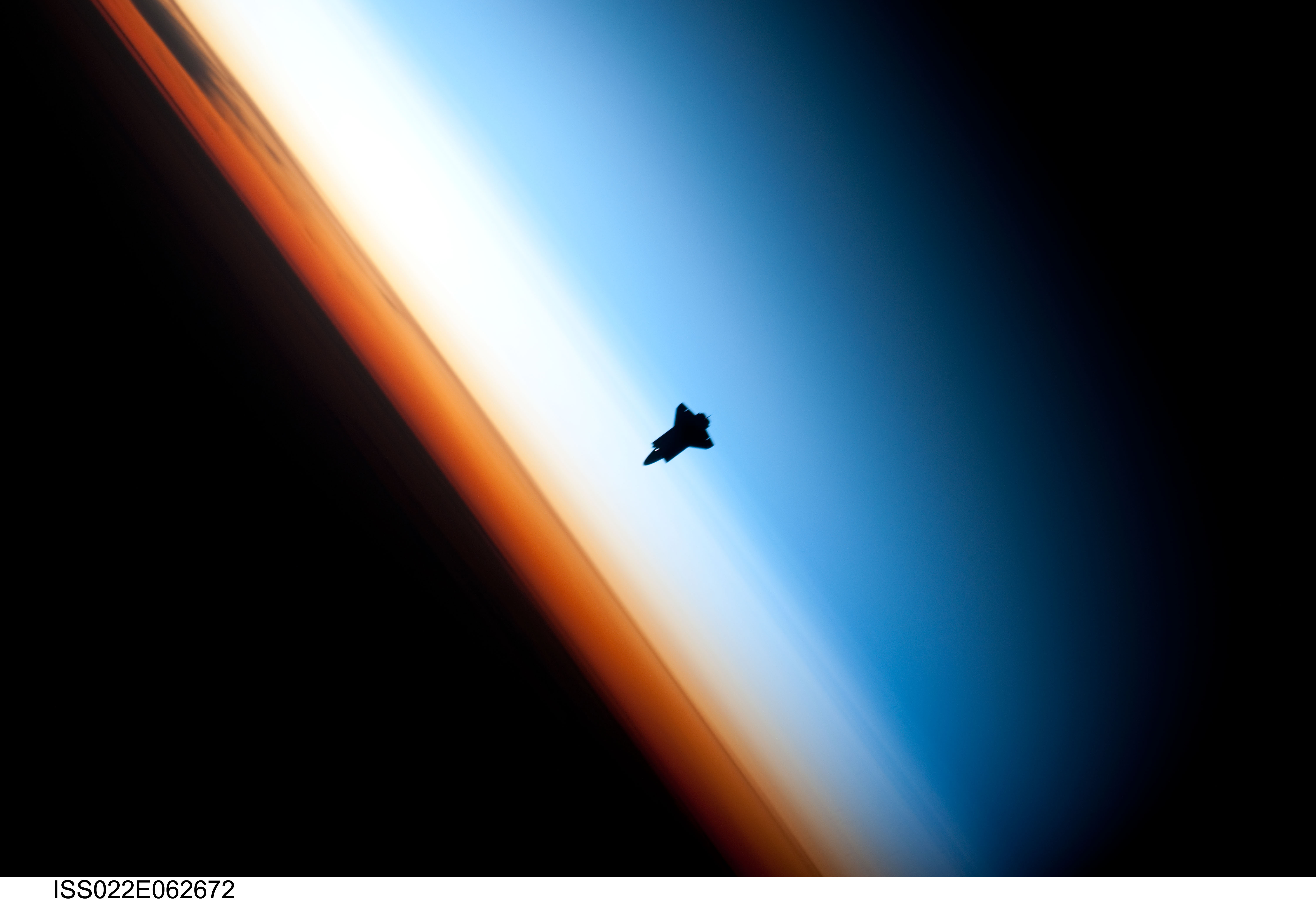 Photo of a space shuttle in orbit
