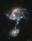 Why are stars forming in the bridge between these colliding galaxies?