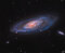 What's happening at the center of spiral galaxy M106?