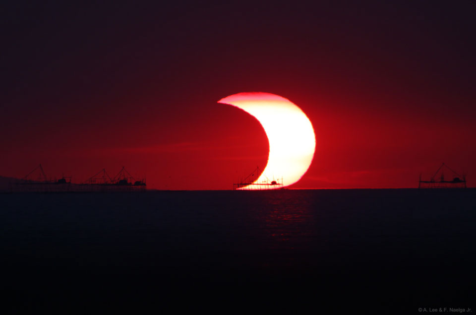 马尼拉湾上空的日偏食