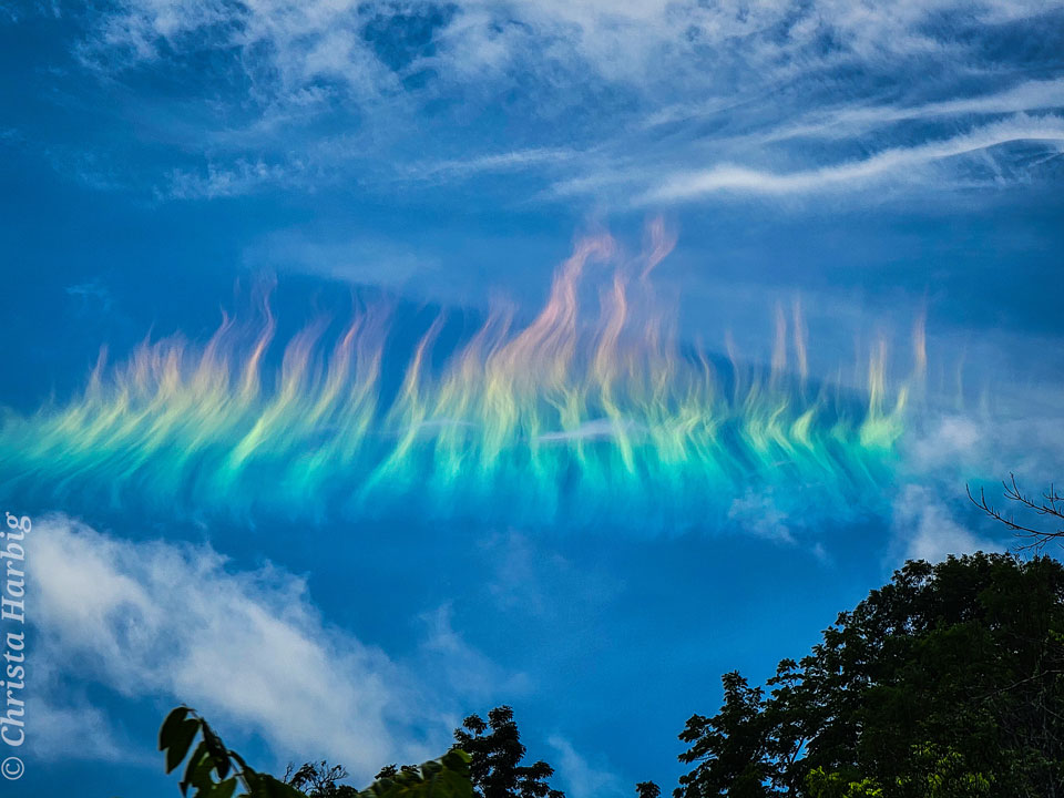 The picture shows a solar circumhorizontal arc -- nicknamed a fire rainbow  -- over West Virgina, USA.   Please see the explanation for more detailed information.