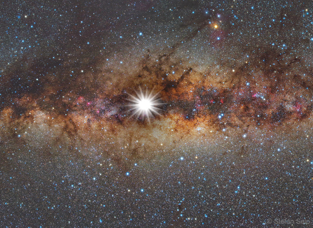 The featured image shows a composite image of the Sun  superposed on the Milky Way. The image shows the night sky  you would see if the Sun was very dim.   Please see the explanation for more detailed information.