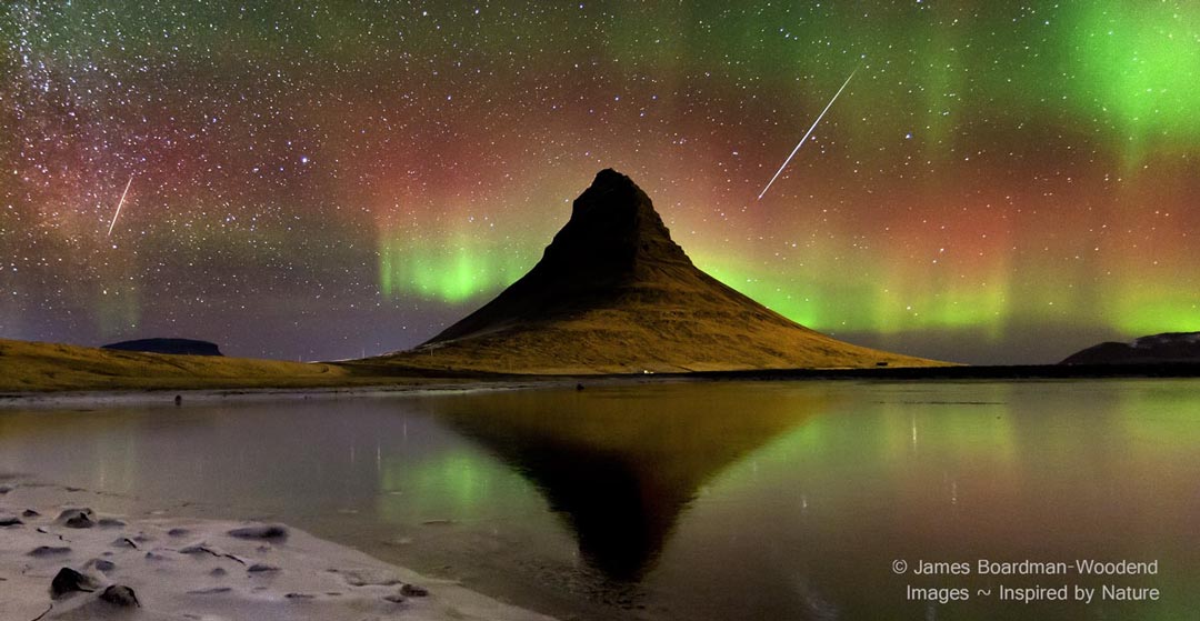 The picture shows a volcano in Iceland in the foreground and both auroras and meteors from the 2012 Geminids in the background. Please see the explanation for more detailed information.