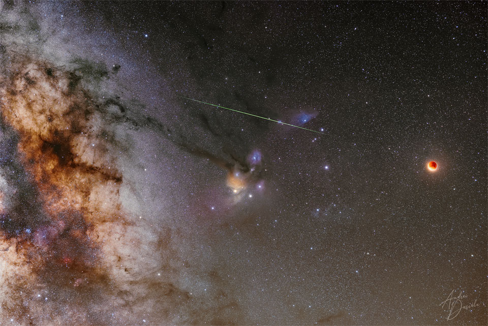 The featured image shows the Rho Ophiuchi gas clouds with a
the Moon in total lunar eclipse to the right. Also in the frame are
a bright meteor and the part of the central band of our Milky Way
galaxy.
Please see the explanation for more detailed information.
