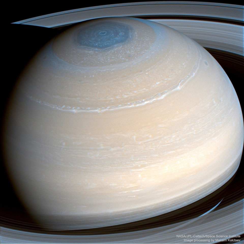 The featured image shows Saturn in infrared light as  captured by the Saturn-orbiting Cassini spacecraft in 2014.  Easily visible are many cloud bands, rings, and the hexagonal cloud pattern surrounding Saturn's north pole.  Please see the explanation for more detailed information.