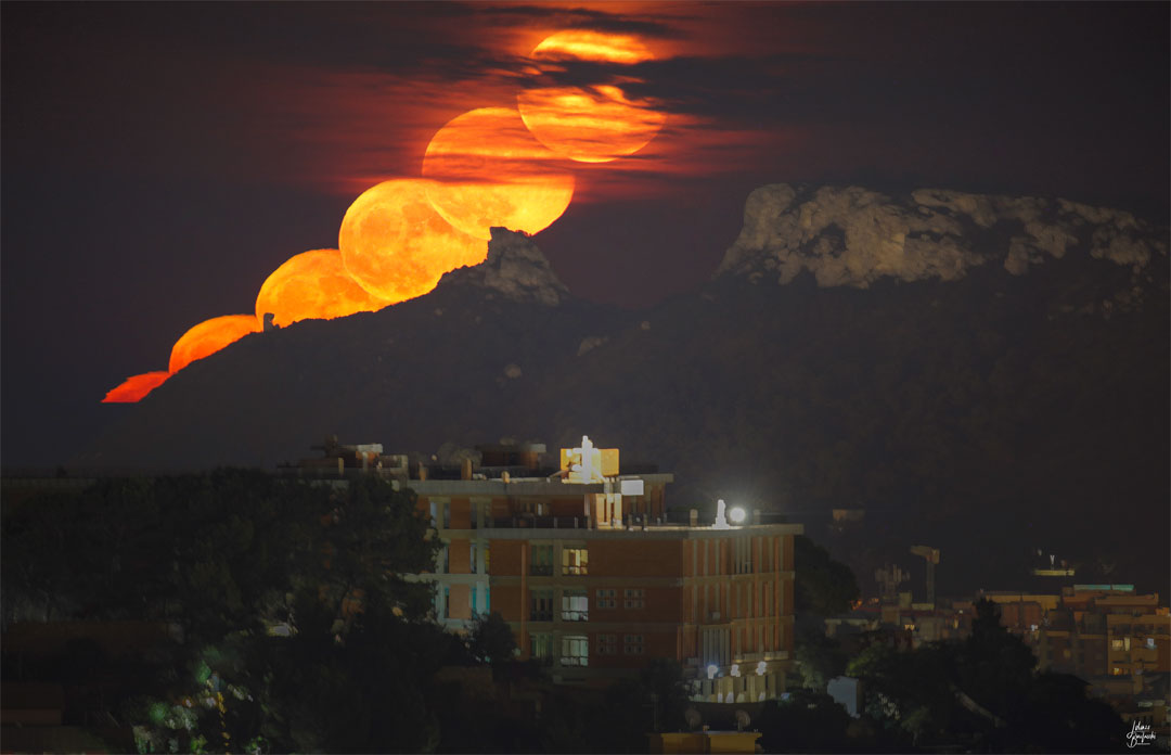 The featured image shows an orange moon rising beyond picturesque mountains.  Please see the explanation for more detailed information.