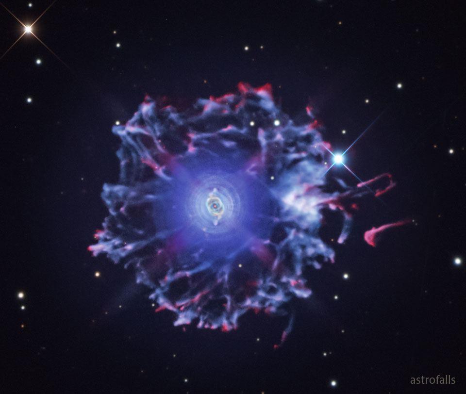 The featured image shows a wide field image of the   Cat's Eye nebula showing it to be surrounded by a large  halo with many vertexes.   Please see the explanation for more detailed information.