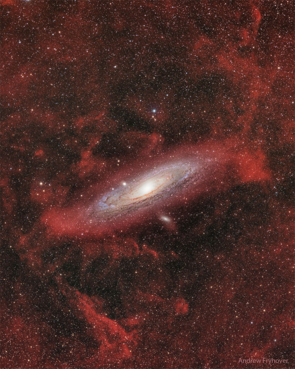 The featured image shows the nearby galaxy M31 surrounded
by unfamiliar red glowing clouds.
Please see the explanation for more detailed information.