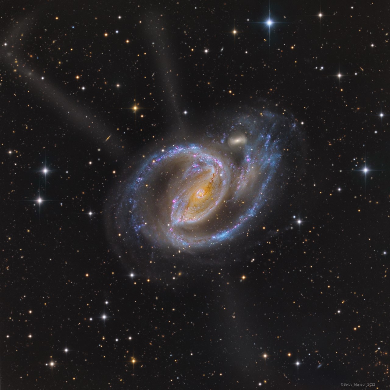 APOD: 2022 November 16 - In the Arms of NGC 1097