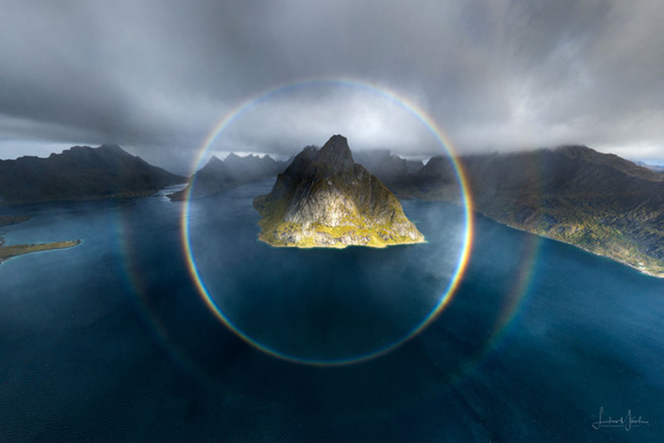 The featured image shows two complete circular rainbows
centered on a mountainous island. 
Please see the explanation for more detailed information.