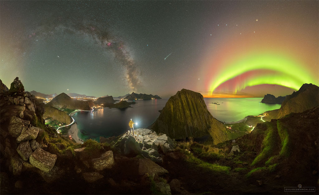 The featured image shows a person standing in mountainous
terrain holding a light. Above are many sky icons including 
auroral arcs, the arc of the Milky Way, a meteor, and the
stars of the Big Dipper.
Please see the explanation for more detailed information.