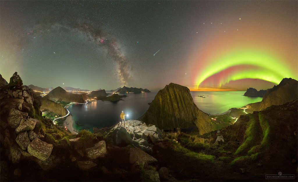 The featured image shows a person standing in mountainous  terrain holding a light. Above are many sky icons including   auroral arcs, the arc of the Milky Way, a meteor, and the  stars of the Big Dipper.  Please see the explanation for more detailed information.