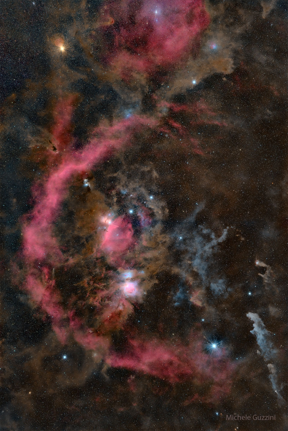 The constellation of Orion is shown, but the image is so deep
that many nebula appear, making the belt stars and surrounding 
star almost recognizable. The rollover image labels the brightest
stars. 
Please see the explanation for more detailed information.