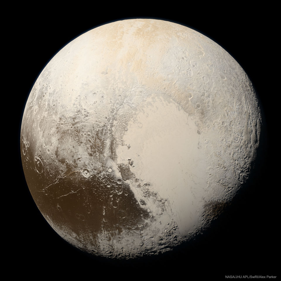 The minor planet Pluto is shown up close, as seen by
the passing New Horizons spacecraft, and in true color. Pluto
is a complex mix of beige regions and some dark brown regions. 
Please see the explanation for more detailed information.