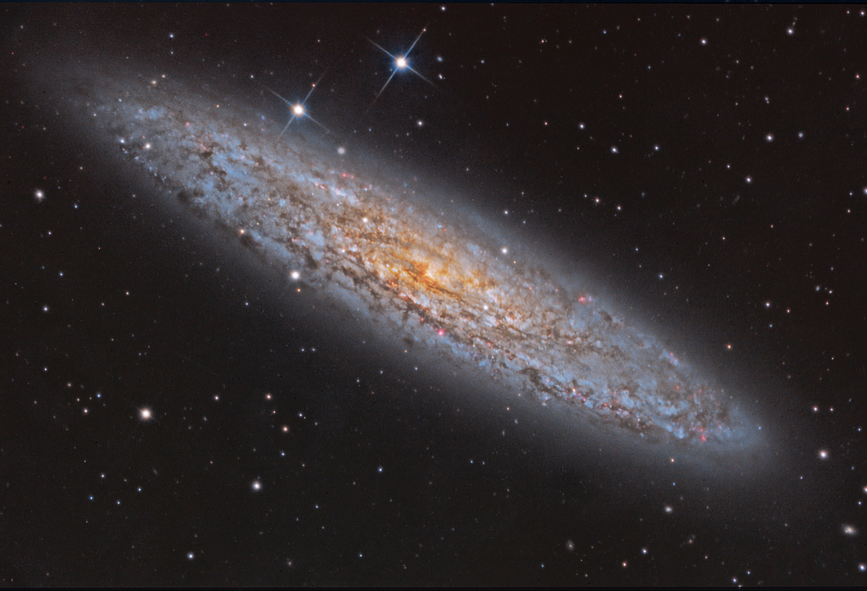 NGC 253; Universo de la Isla Polvorienta
