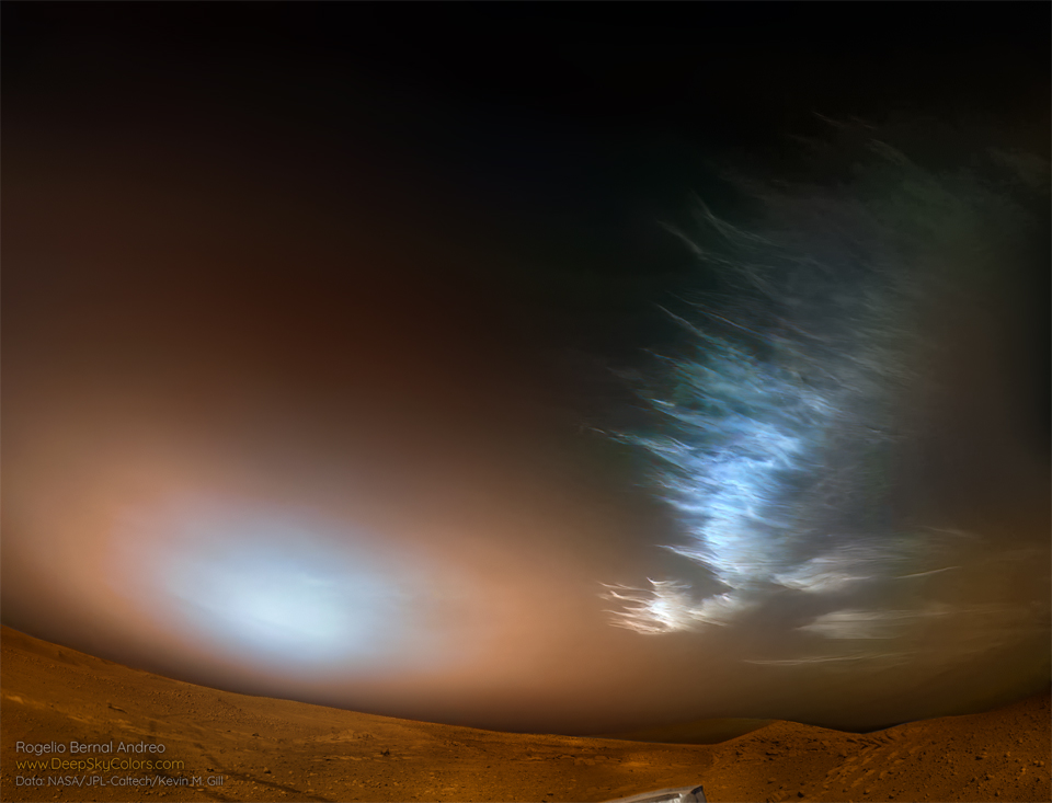 Ice clouds are seen over the surface of Mars on the upper right. Toward the lower left is a bright spot in the sky which is likely the Sun setting through Martian dust. Please see the explanation for more detailed information.