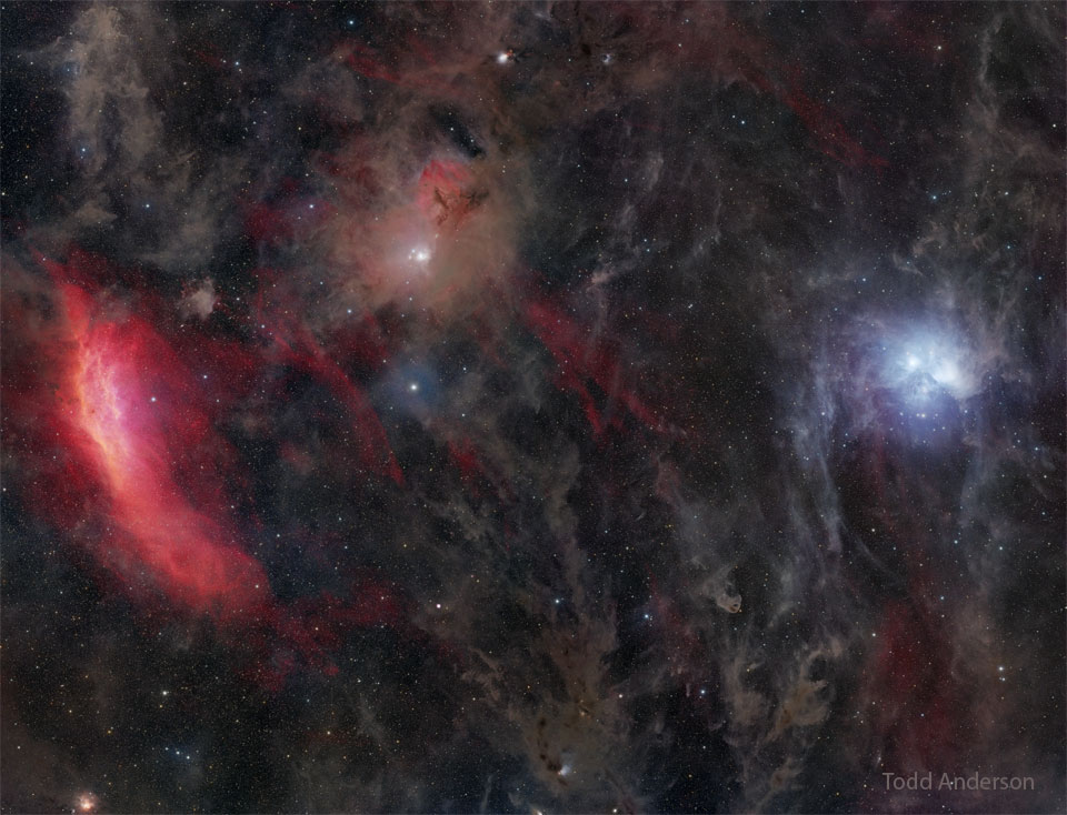 The featured image shows a wide field with the   red California Nebula on the left, the blue   Pleiades Star Cluster on the right, and much brown   interstellar dust in between.   Please see the explanation for more detailed information.