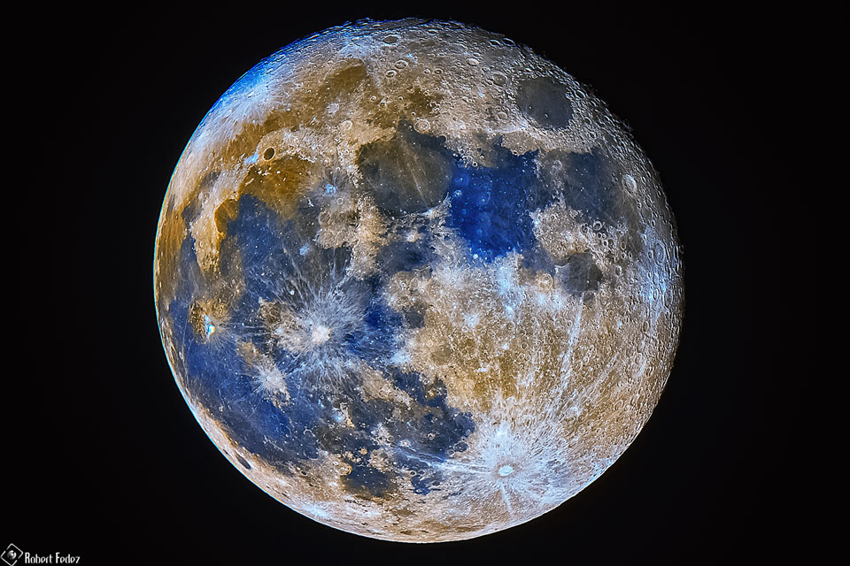 The picture shows the full moon in high resolution and exaggerated colors.
Please see the explanation for more detailed information.