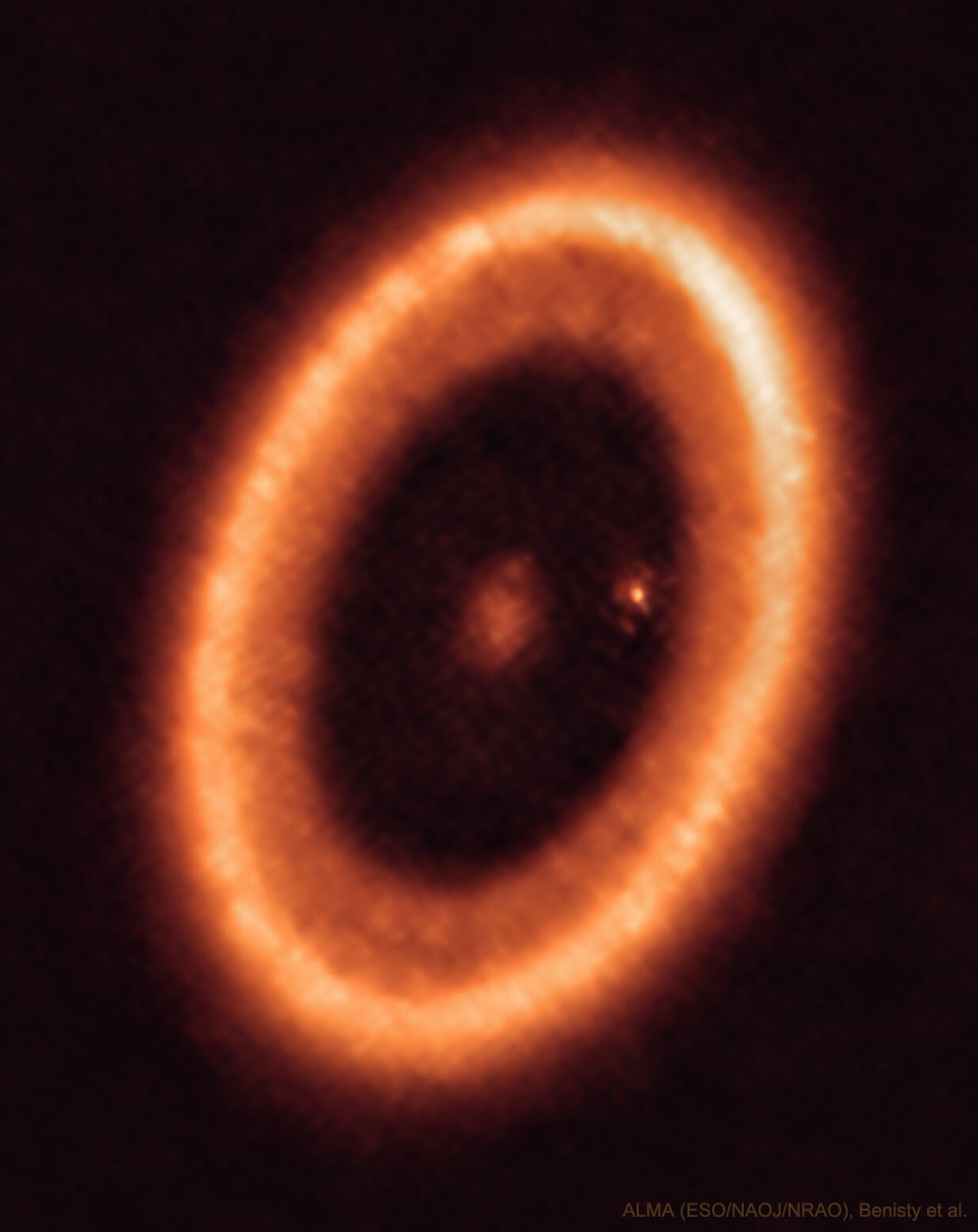 The picture shows planet forming star system PDS 70. 
A planet forming ring is visible as well as a planet still forming a moon.
Please see the explanation for more detailed information.