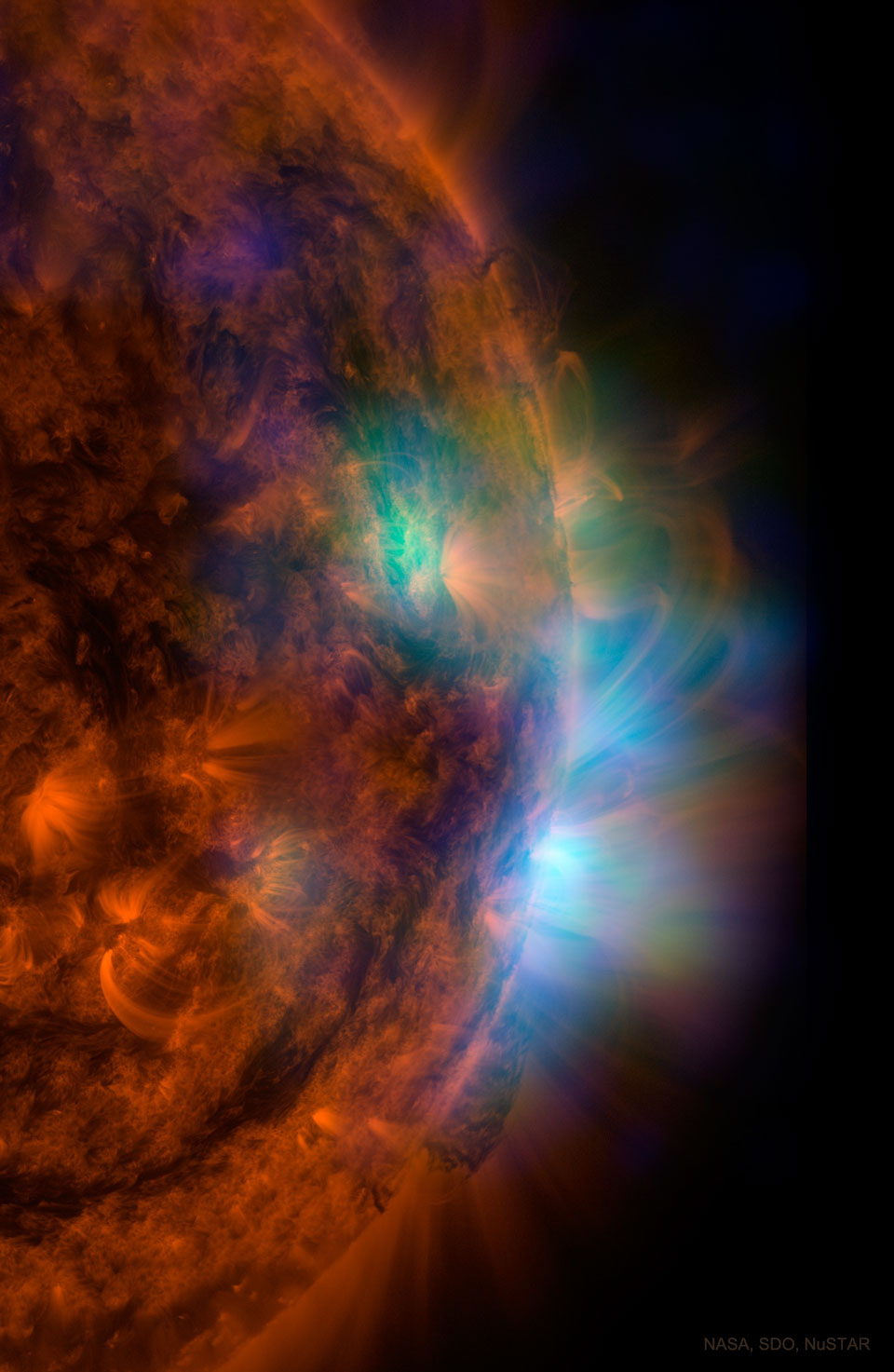 The featured image shows the Sun in X-ray light as
shown by NASA's NuSTAR satellite -- superimposed on an image
in ultraviolet light taken by NASA's Solar Dynamic Observatory.
Please see the explanation for more detailed information.