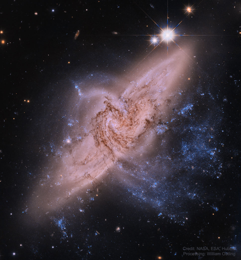 The Hubble image shows the two spiral galaxies 
directly overlapping in the system designated NGC 3314.
Please see the explanation for more detailed information.