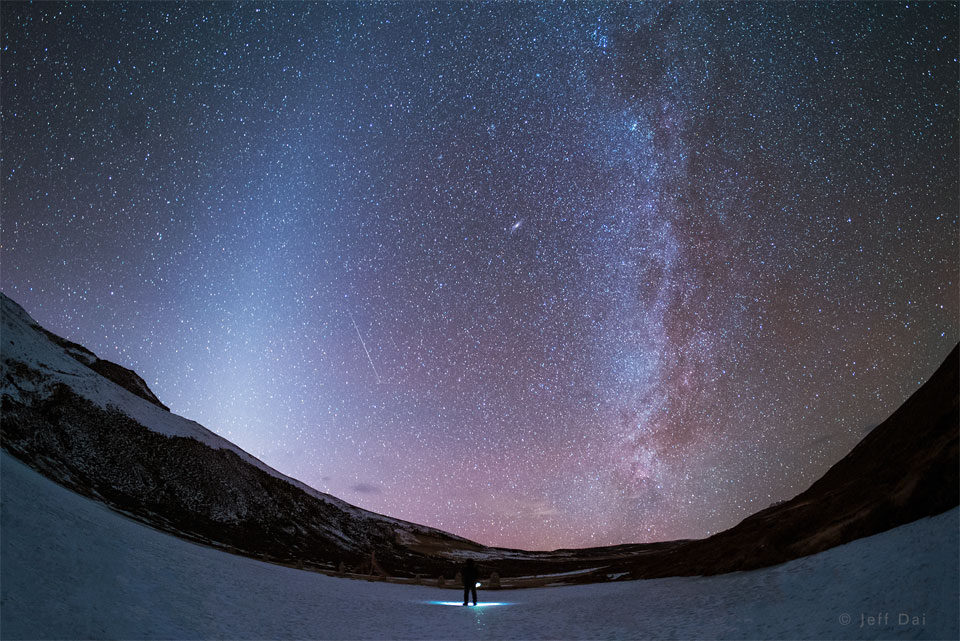The featured image shows a nightscape over China
featuring bands of zodiacal light, on the left, and the central
band of our Milky Way Galaxy, on the right.
Please see the explanation for more detailed information.