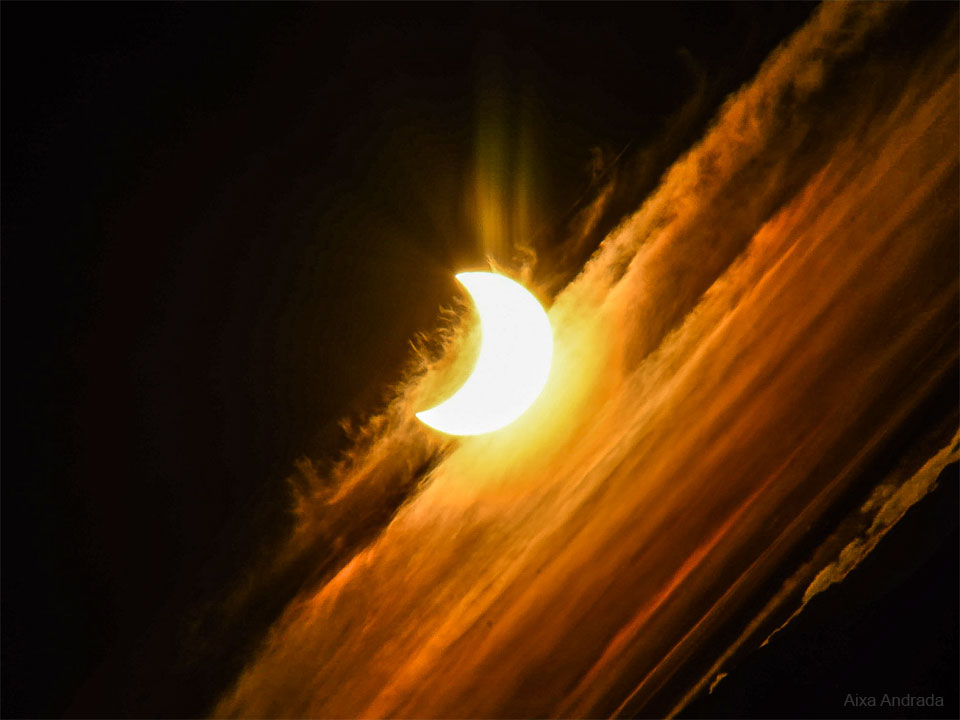 The featured image shows a partially eclipsed Sun
through Earth clouds as it appeared two days ago
during sunset over Patagonia, Argentina.
Please see the explanation for more detailed information.