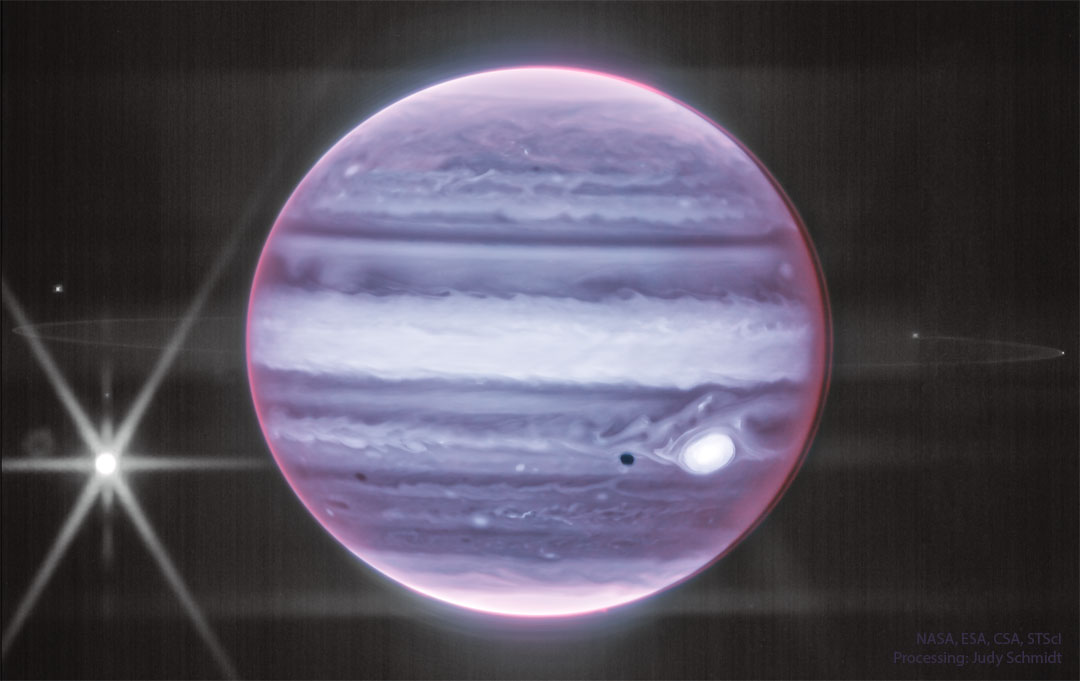 The featured image shows Jupiter in infrared light as captured
by the James Webb Space Telescope. Visible are clouds, the Great
Red Spot -- appearing light in color -- and a prominent ring around
the giant planet.
Please see the explanation for more detailed information.