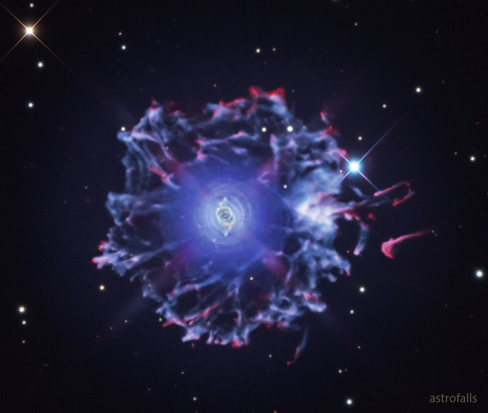 The featured image shows a wide field image of the 
Cat's Eye nebula showing it to be surrounded by a large
halo with many vertexes. 
Please see the explanation for more detailed information.