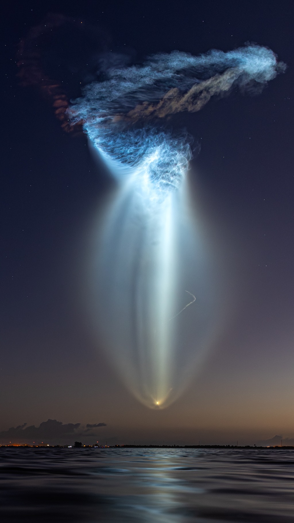 A SpaceX Falcon 9 rocket launch produces a glowing cloud,
	  reminiscent of a jellyfish.
	  Please see the explanation for more detailed information.