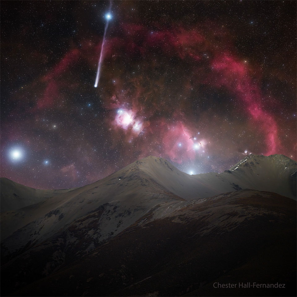 A starfield appears featuring many bright stars, red 
nebula, and a comet. Snow covered mountains cover the foreground.
The comet appears on the upper left with a tail the goes
upward and right through a bright star. 
Please see the explanation for more detailed information.